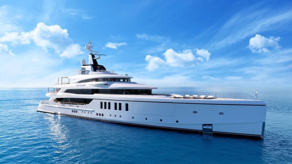Side view of the superyacht ARTISAN cruising on calm blue waters under a clear sky.