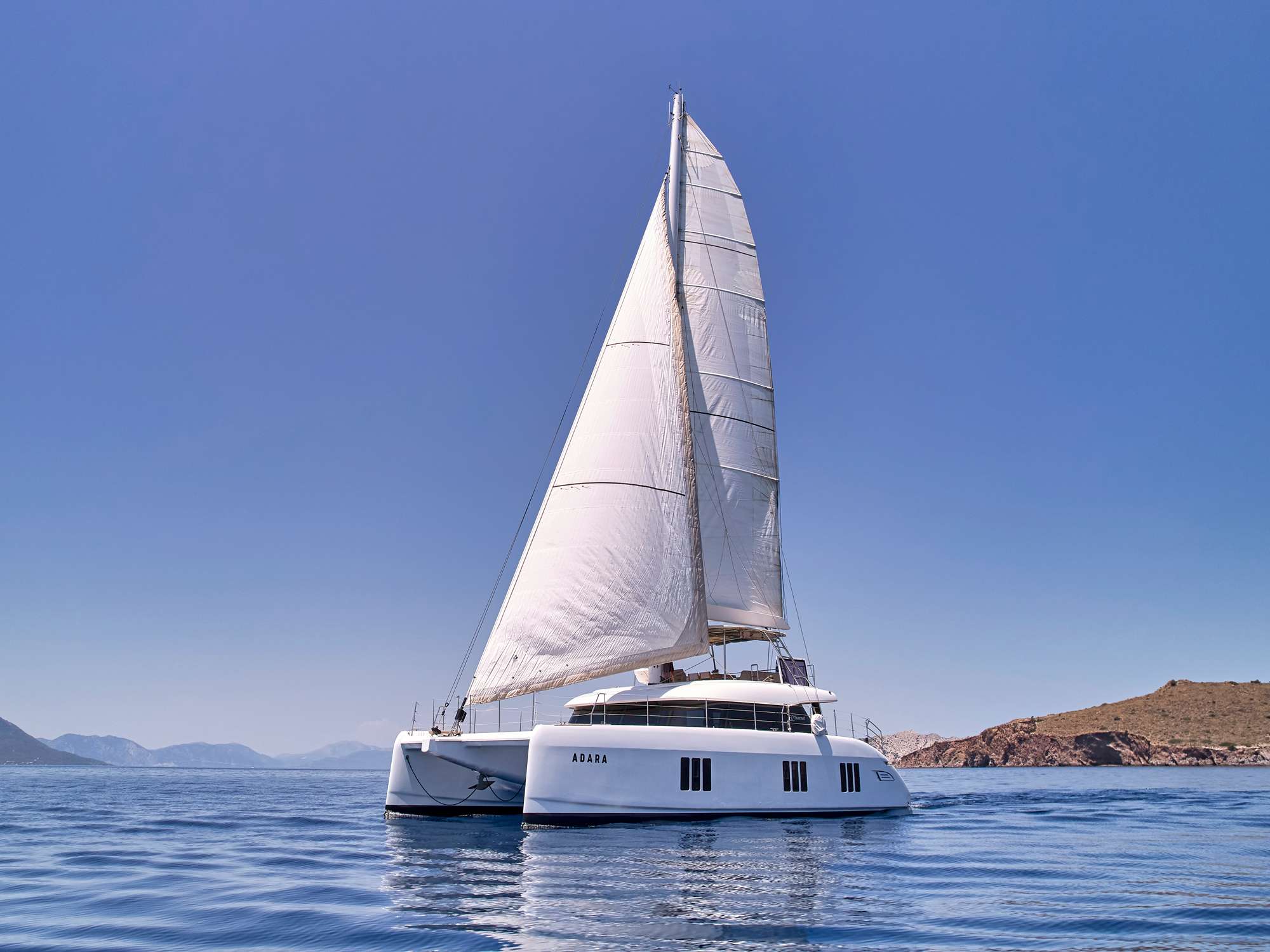 ADARA luxury catamaran sailing on calm waters in Greece
